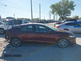 2016 Ford Fusion Titanium Hybrid with VIN 3FA6P0RU8GR127140, listed as a IAAI auction lot 41750405 with 110,861 mi miles. Bid and sale history available at carsss.com. Image 14.