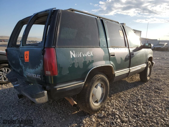 1999 Chevrolet Tahoe Z71 with VIN 1GNEK13R0XJ512661, listed as a Copart auction lot 68022173 with 181,573 mi miles and Salvage Title. Bid and sale history available at carsss.com. Image 3.