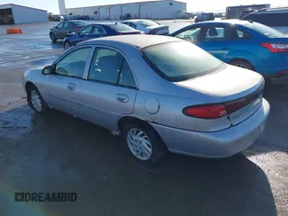1999 Ford Escort SE with VIN 1FAFP13P8XW185612, listed as a IAAI auction lot 41097304 with 221,752 mi miles. Bid and sale history available at carsss.com. Image 3.