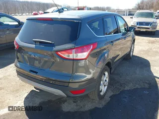 2016 Ford Escape SE with VIN 1FMCU9GX7GUA58243, listed as a IAAI auction lot 41856764 with 50,129 mi miles and . Bid and sale history available at DreamBid. Image 4.