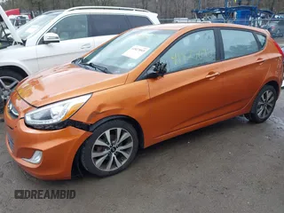 2015 Hyundai Accent Sport with VIN KMHCU5AE3FU205849, listed as a IAAI auction lot 41827093 with 112,980 mi miles. Bid and sale history available at carsss.com. Image 2.