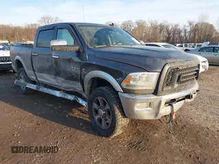 2015 Ram 2500 Laramie z VIN 3C6UR5FL9FG539203, wystawiony jako IAAI lot #41441571 z przebiegiem 213 481 mil mil oraz . Historia ofert i sprzedaży dostępna na DreamBid. Obrazek 1.