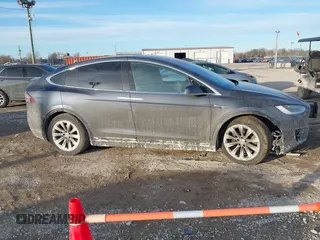 2017 Tesla Model X 90D with VIN 5YJXCDE23HF051321, listed as a IAAI auction lot 41415384 with 127,476 mi miles and . Bid and sale history available at carsss.com. Image 12.