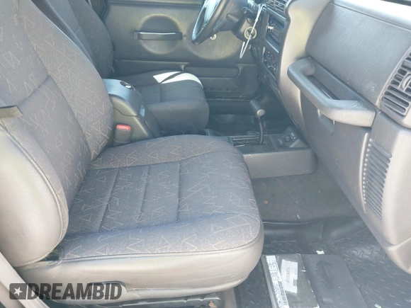 2002 Jeep Wrangler Sport with VIN 1J4FA49S52P700846, listed as a IAAI auction lot 42052276 with 231,851 mi miles. Bid and sale history available at carsss.com. Image 5.