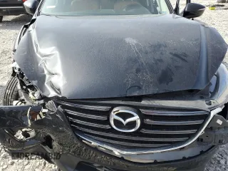 2016 Mazda CX-5 Touring z VIN JM3KE4CY0G0667171, wystawiony jako Copart lot #51579005 z przebiegiem 39 487 mil mil oraz Szkoda całkowita • Salvage title. Historia ofert i sprzedaży dostępna na DreamBid. Obrazek 13.