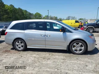 2012 Honda Odyssey Touring with VIN 5FNRL5H96CB043939, listed as a IAAI auction lot 41983643 with 202,535 mi miles. Bid and sale history available at carsss.com. Image 14.