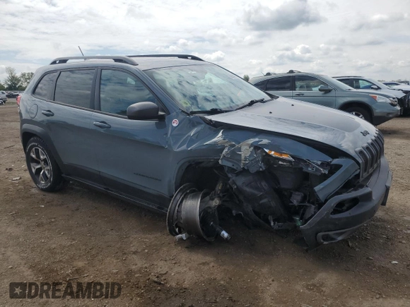 2015 Jeep Cherokee Trailhawk with VIN 1C4PJMBB1FW630715, listed as a Copart auction lot 58559675 with 58,302 mi miles and Salvage title. Bid and sale history available at DreamBid. Image 4.