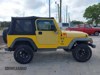 2002 Jeep Wrangler X z VIN 1J4FA39S82P719241, wystawiony jako IAAI lot #42150742 z przebiegiem 147 914 mil mil oraz . Historia ofert i sprzedaży dostępna na DreamBid. Obrazek 13.