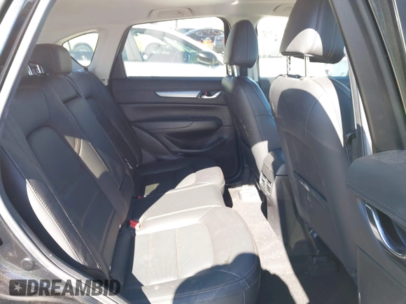 2021 Mazda CX-5 Touring with VIN JM3KFACM2M0339349, listed as a IAAI auction lot 41651005 with 53,792 mi miles. Bid and sale history available at carsss.com. Image 8.
