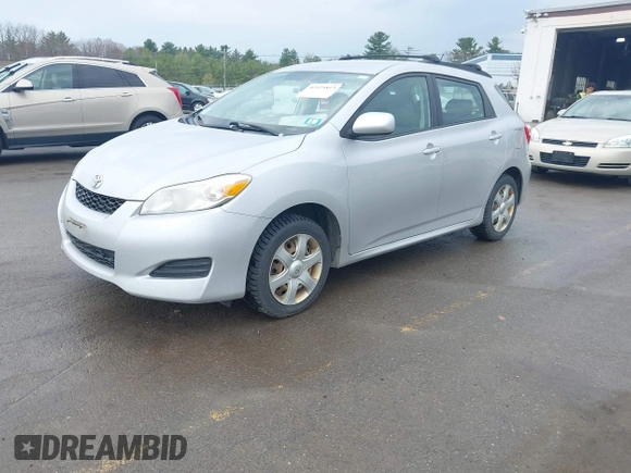 2009 Toyota Matrix with VIN 2T1KU40E99C006768, listed as a IAAI auction lot 42125813 with 163,832 mi miles. Bid and sale history available at carsss.com. Image 2.
