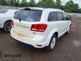 2017 Dodge Journey SXT z VIN 3C4PDCBG4HT531635, wystawiony jako IAAI lot #42460200 z przebiegiem 152 293 mil mil oraz . Historia ofert i sprzedaży dostępna na DreamBid. Obrazek 4.