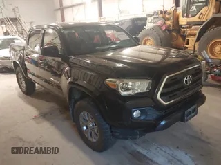 2016 Toyota Tacoma SR with VIN 3TMCZ5AN0GM035087, listed as a IAAI auction lot 42590802 with 77,375 mi miles and . Bid and sale history available at DreamBid. Image 1.