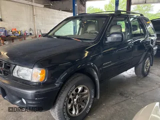 2002 Isuzu Rodeo S with VIN 4S2CK58W124336947, listed as a Copart auction lot 63482935 with 248,008 mi miles and Clean title. Bid and sale history available at DreamBid. Image 2.