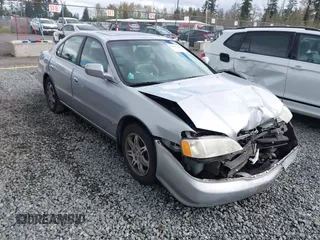 1999 Acura TL with VIN 19UUA5657XA021688, listed as a IAAI auction lot 41997466 with 241,232 mi miles. Bid and sale history available at carsss.com. Image 1.