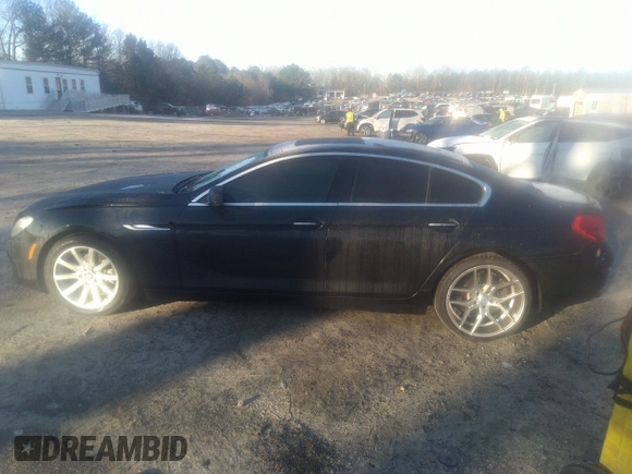 2014 BMW 6 Series 640i z VIN WBA6A0C55EDZ04549, wystawiony jako IAAI lot #41764155 z przebiegiem 154 705 mil mil oraz . Historia ofert i sprzedaży dostępna na DreamBid. Obrazek 14.