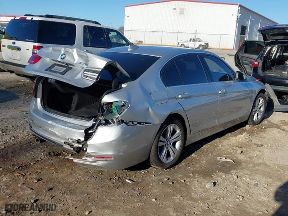 2018 BMW 3 Series 330i with VIN WBA8B9G58JNU97318, listed as a IAAI auction lot 41205434 with 62,582 mi miles. Bid and sale history available at carsss.com. Image 4.