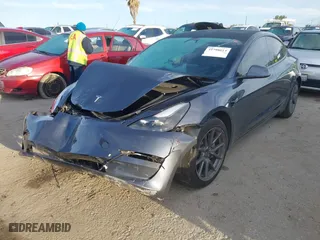 2023 Tesla Model 3 with VIN 5YJ3E1EA9PF569494, listed as a IAAI auction lot 41798014 with 18,372 mi miles. Bid and sale history available at carsss.com. Image 2.