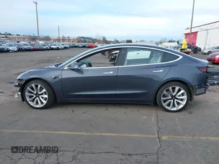 2018 Tesla Model 3 Long Range Battery with VIN 5YJ3E1EB9JF097118, listed as a IAAI auction lot 41619510 with 64,132 mi miles and . Bid and sale history available at DreamBid. Image 15.