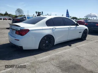 2013 BMW 7 Series 750i with VIN WBAYA8C54DC996412, listed as a Copart auction lot 56982895 with 124,258 mi miles and Salvage title. Bid and sale history available at DreamBid. Image 3.