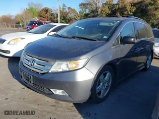 2013 Honda Odyssey Touring with VIN 5FNRL5H9XDB009973, listed as a IAAI auction lot 41904710 with 219,067 mi miles. Bid and sale history available at carsss.com. Image 18.