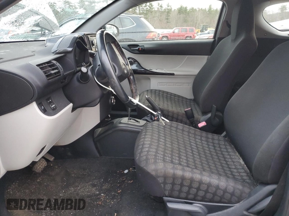 2012 Scion iQ with VIN JTNJJXB03CJ018641, listed as a Copart auction lot 82653104 with 118,617 mi miles and Salvage Title. Bid and sale history available at carsss.com. Image 7.