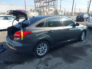 2018 Ford Focus SE with VIN 1FADP3F27JL285891, listed as a IAAI auction lot 41750264 with 103,815 mi miles. Bid and sale history available at carsss.com. Image 4.