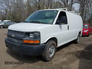 2014 Chevrolet Express Cargo Van with VIN 1GCWGFCA7E1110011, listed as a IAAI auction lot 41983301 with 114,827 mi miles. Bid and sale history available at carsss.com. Image 2.