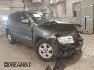 2012 Jeep Grand Cherokee Laredo with VIN 1C4RJFAG3CC209142, listed as a IAAI auction lot 41978296 with 201,796 mi miles. Bid and sale history available at carsss.com. Image 1.