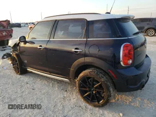 2015 MINI Countryman S with VIN WMWZC5C57FWP48606, listed as a Copart auction lot 47212255 with 104,922 mi miles and Salvage Title. Bid and sale history available at DreamBid. Image 2.