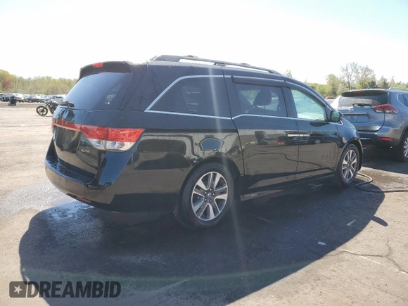 2014 Honda Odyssey Touring with VIN 5FNRL5H99EB088859, listed as a Copart auction lot 54828555 with 147,147 mi miles and Salvage Title. Bid and sale history available at DreamBid. Image 3.