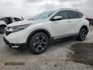 2018 Honda CR-V Touring с VIN 2HKRW1H93JH516419, выставлен на аукционе Copart как лот 61497345 с пробегом 39 536 миль миль и Списание • Salvage title. История ставок и продаж доступна на DreamBid. Изображение 1.
