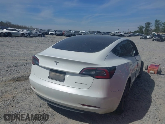 2022 Tesla Model 3 Long Range with VIN 5YJ3E1EB0NF106570, listed as a IAAI auction lot 41832622 with 52,679 mi miles and . Bid and sale history available at DreamBid. Image 4.