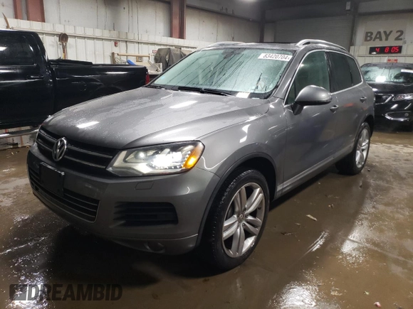 2013 Volkswagen Touareg Lux with VIN WVGEF9BP6DD002607, listed as a Copart auction lot 83420704 with 143,571 mi miles and Salvage Title. Bid and sale history available at DreamBid. Image 1.