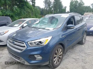 2018 Ford Escape Titanium with VIN 1FMCU0J99JUA12717, listed as a IAAI auction lot 42237509 with 123,896 mi miles and . Bid and sale history available at DreamBid. Image 2.