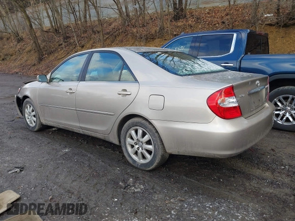 2003 Toyota Camry LE with VIN 4T1BE30K13U705105, listed as a IAAI auction lot 41696395 with 191,389 mi miles and . Bid and sale history available at DreamBid. Image 3.