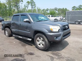 2014 Toyota Tacoma PreRunner z VIN 3TMJU4GN9EM169536, wystawiony jako IAAI lot #42403354 z przebiegiem 215 650 mil mil oraz . Historia ofert i sprzedaży dostępna na DreamBid. Obrazek 1.