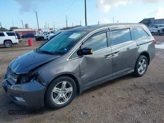 2011 Honda Odyssey Touring with VIN 5FNRL5H93BB104436, listed as a IAAI auction lot 40426003 with 93,342 mi miles and . Bid and sale history available at DreamBid. Image 17.