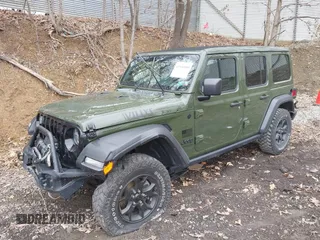 2021 Jeep Wrangler Unlimited Willys with VIN 1C4HJXDNXMW579595, listed as a IAAI auction lot 41930989 with 32,148 mi miles and . Bid and sale history available at DreamBid. Image 2.