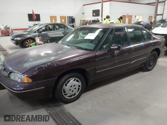 1999 Pontiac Bonneville SE z VIN 1G2HX52K2XH219410, wystawiony jako IAAI lot #41755411 z przebiegiem 187 752 mil mil oraz . Historia ofert i sprzedaży dostępna na DreamBid. Obrazek 2.