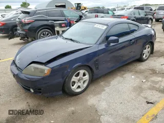 2003 Hyundai Tiburon GT z VIN KMHHN65F73U018847, wystawiony jako Copart lot #58242385 z przebiegiem 164 976 mil mil oraz Szkoda całkowita • Salvage title. Historia ofert i sprzedaży dostępna na DreamBid. Obrazek 1.