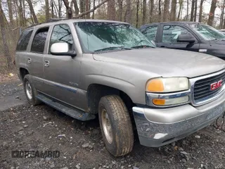 2003 GMC Yukon SLT with VIN 1GKEC13Z23R141573, listed as a IAAI auction lot 41872751 with 1 mi miles. Bid and sale history available at carsss.com. Image 1.