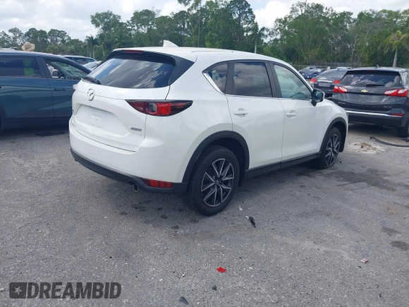 2018 Mazda CX-5 Touring z VIN JM3KFACM6J1419663, wystawiony jako IAAI lot #41879677 z przebiegiem 115 224 mil mil oraz . Historia ofert i sprzedaży dostępna na DreamBid. Obrazek 4.