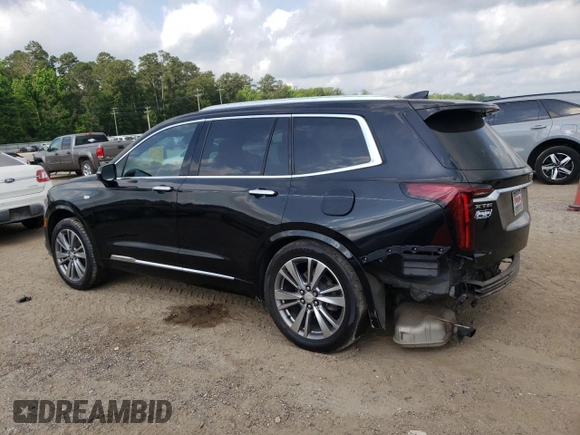 2020 Cadillac XT6 FWD Premium Luxury with VIN 1GYKPCRS6LZ102682, listed as a Copart auction lot 56906645 with 76,884 mi miles and Salvage title. Bid and sale history available at DreamBid. Image 2.