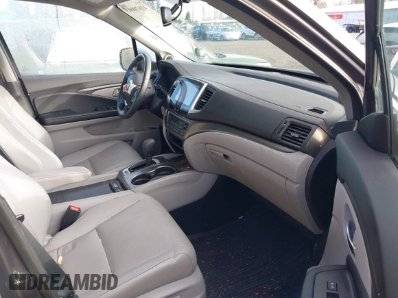 2017 Honda Pilot EX-L with VIN 5FNYF6H5XHB059834, listed as a IAAI auction lot 41670003 with 58,285 mi miles and . Bid and sale history available at DreamBid. Image 5.