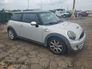 2011 MINI Hardtop S with VIN WMWSV3C58BTY11580, listed as a Copart auction lot 62081615 with 112,336 mi miles and Salvage title. Bid and sale history available at DreamBid. Image 4.