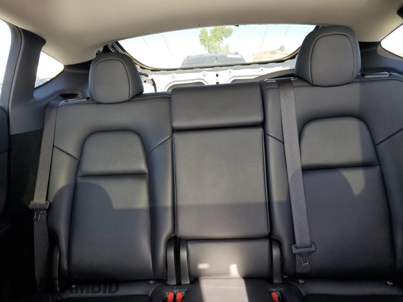 2024 Tesla Model Y Long Range с VIN 7SAYGDEE8RF983067, выставлен на аукционе Copart как лот 61217015 с пробегом 57 082 миль миль и Списание • Salvage title. История ставок и продаж доступна на DreamBid. Изображение 10.