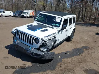 2023 Jeep Wrangler Rubicon with VIN 1C4JJXR68PW584303, listed as a IAAI auction lot 42049098 with 29,565 mi miles and . Bid and sale history available at DreamBid. Image 2.