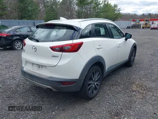 2018 Mazda CX-3 Touring with VIN JM1DKFC71J0315074, listed as a IAAI auction lot 42029790 with 100,268 mi miles. Bid and sale history available at carsss.com. Image 4.