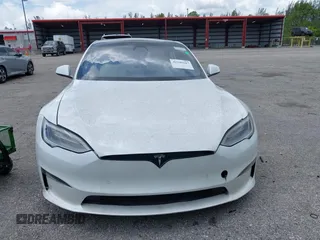 2022 Tesla Model S Plaid with VIN 5YJSA1E61NF460155, listed as a IAAI auction lot 42545167 with 51,711 mi miles and . Bid and sale history available at DreamBid. Image 6.