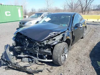 2014 Infiniti Q50 Premium with VIN JN1BV7AR0EM689783, listed as a IAAI auction lot 41661020 with 124,762 mi miles. Bid and sale history available at carsss.com. Image 2.
